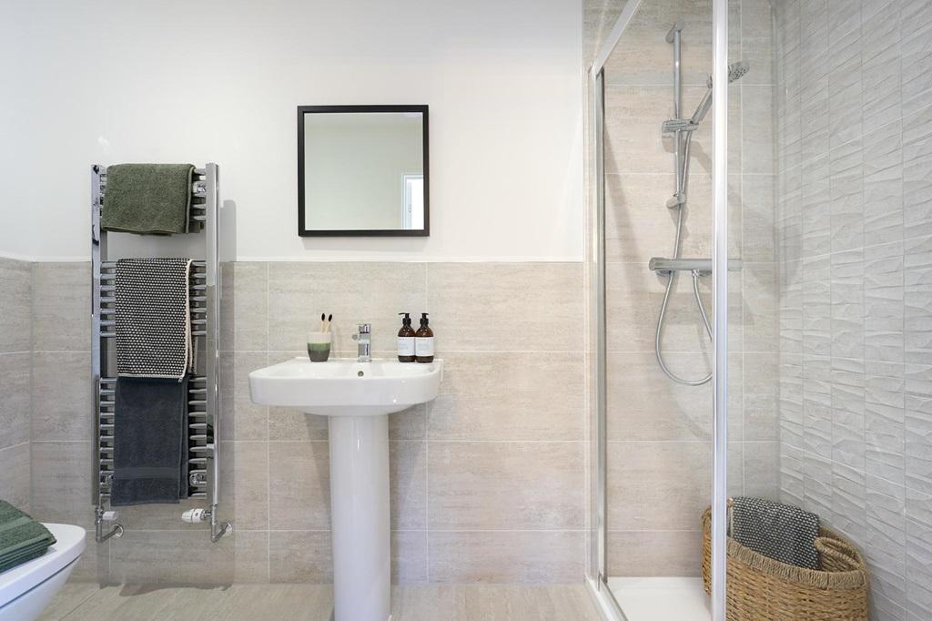 En suite to bedroom 1 with full width shower...