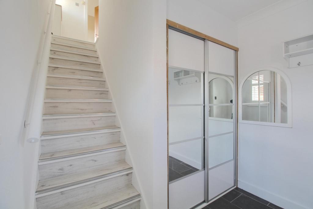 Spacious hallway with built in storage