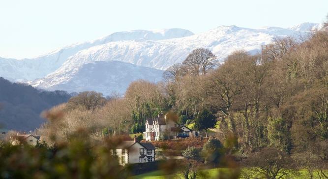 View of Bryn Eglwys and 5 gables snowy mountains.J