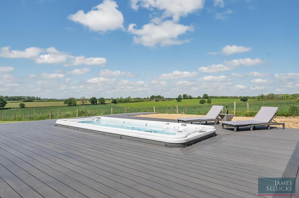 Decked entertaining area with sunken hot tub