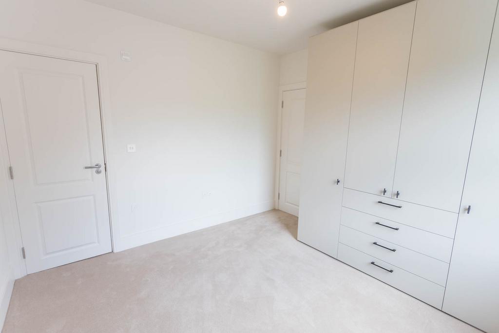 Bedroom 1 with extensive cupboards