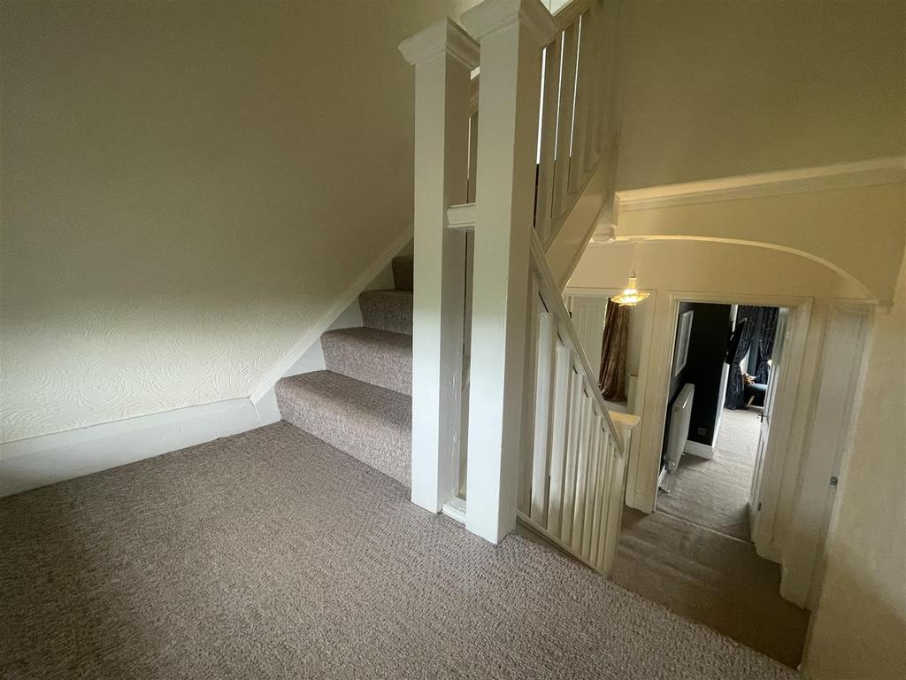 Staircase and landing to the second floor