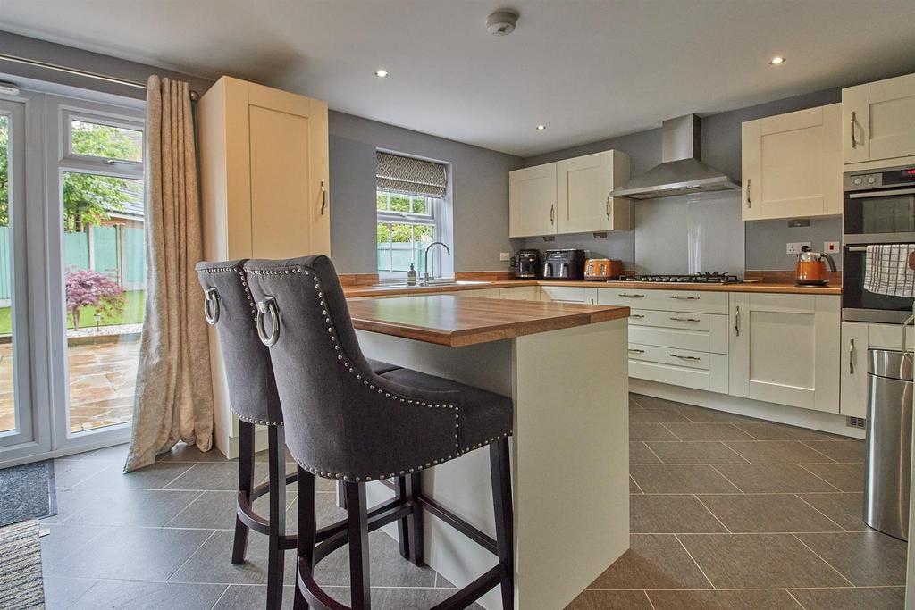 Open plan living dining kitchen to rear