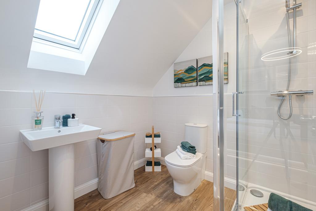 Photo of a shower room with sloped ceiling