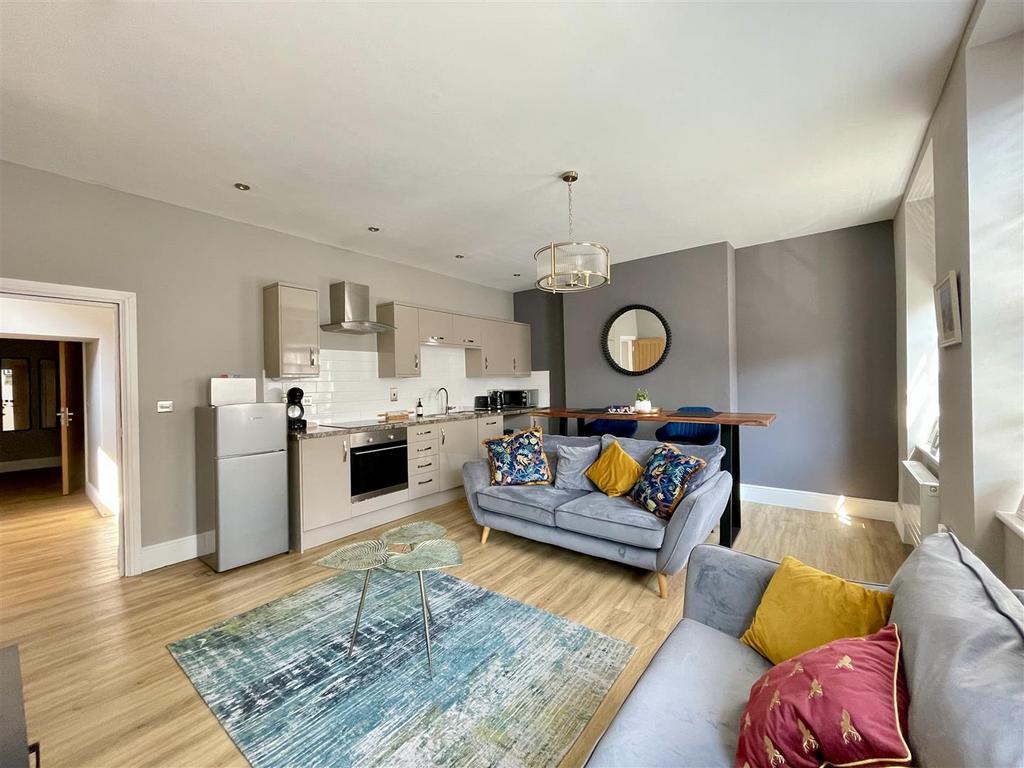 Open plan sitting room and kitchen