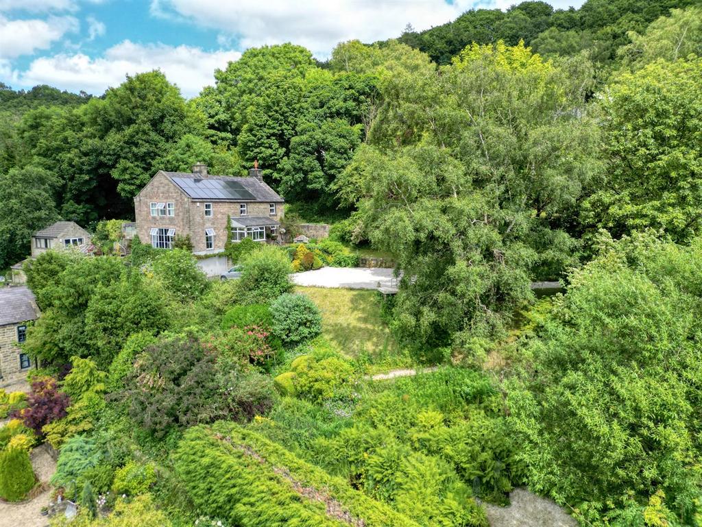 Drone shot - front of home, driveway and front gar
