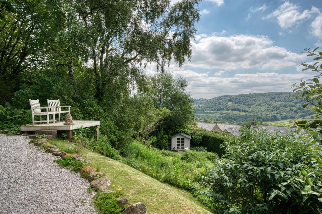 Front garden - seating and summer house.jpg