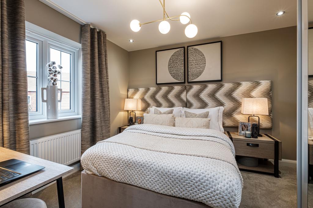 Double bedroom with beige walls and large window