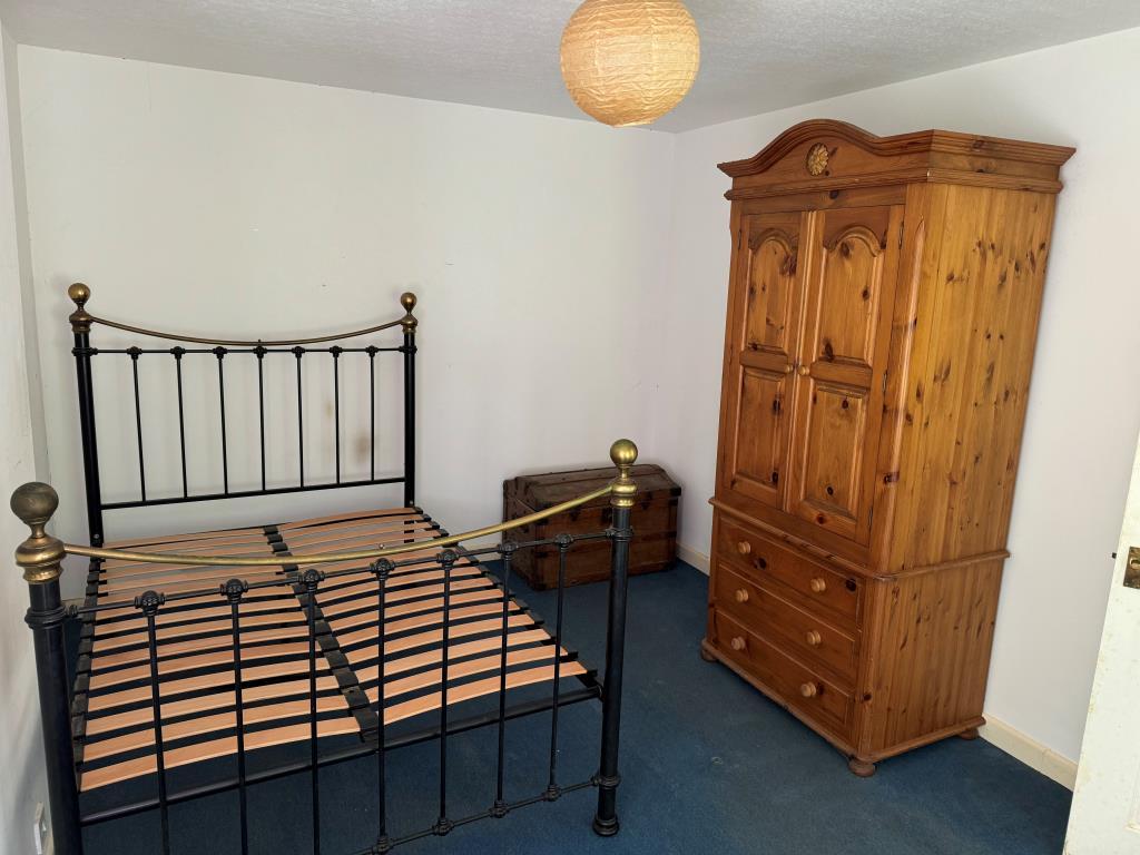 The bedroom shown from the window