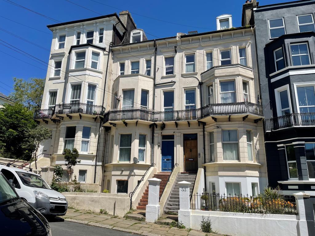 Mid-terrace property arranged as flats