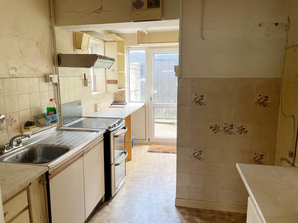 Kitchen units with glazed door to rea garden