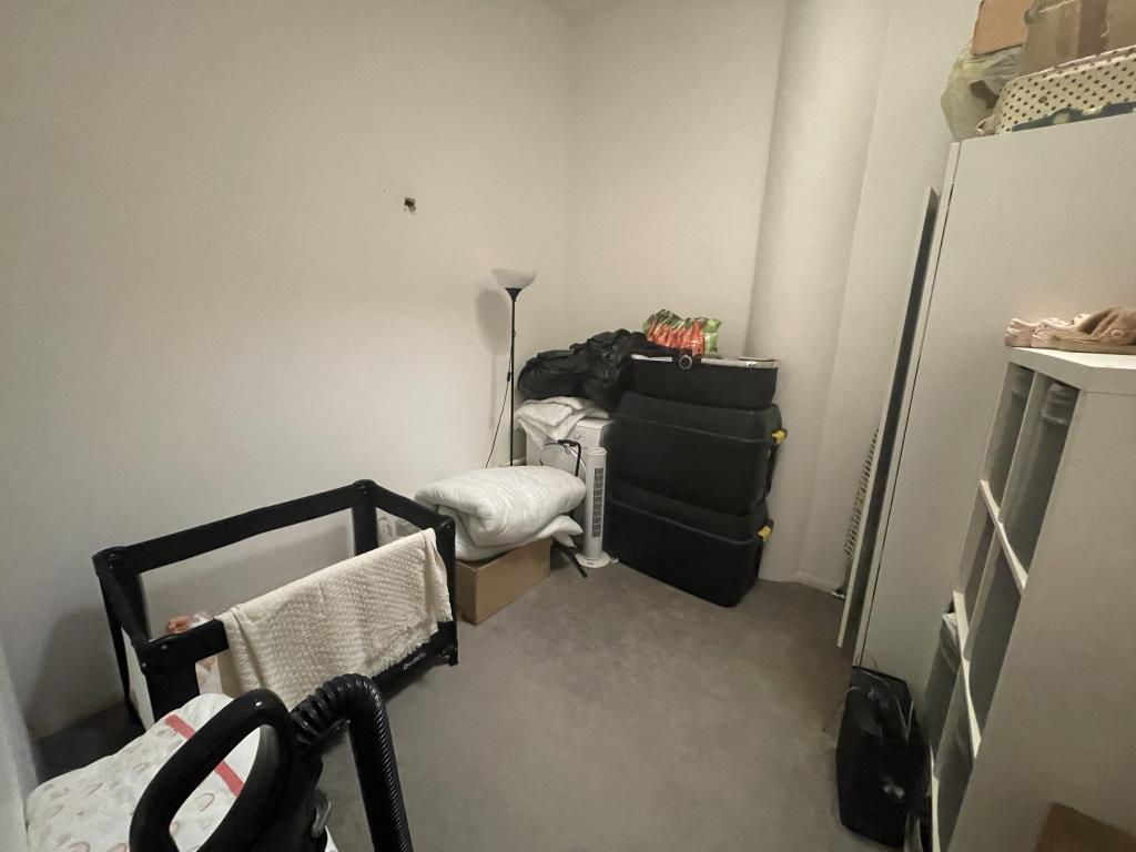 Inside image of second bedroom from hallway