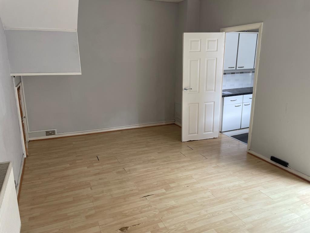 Living room with door to kitchen