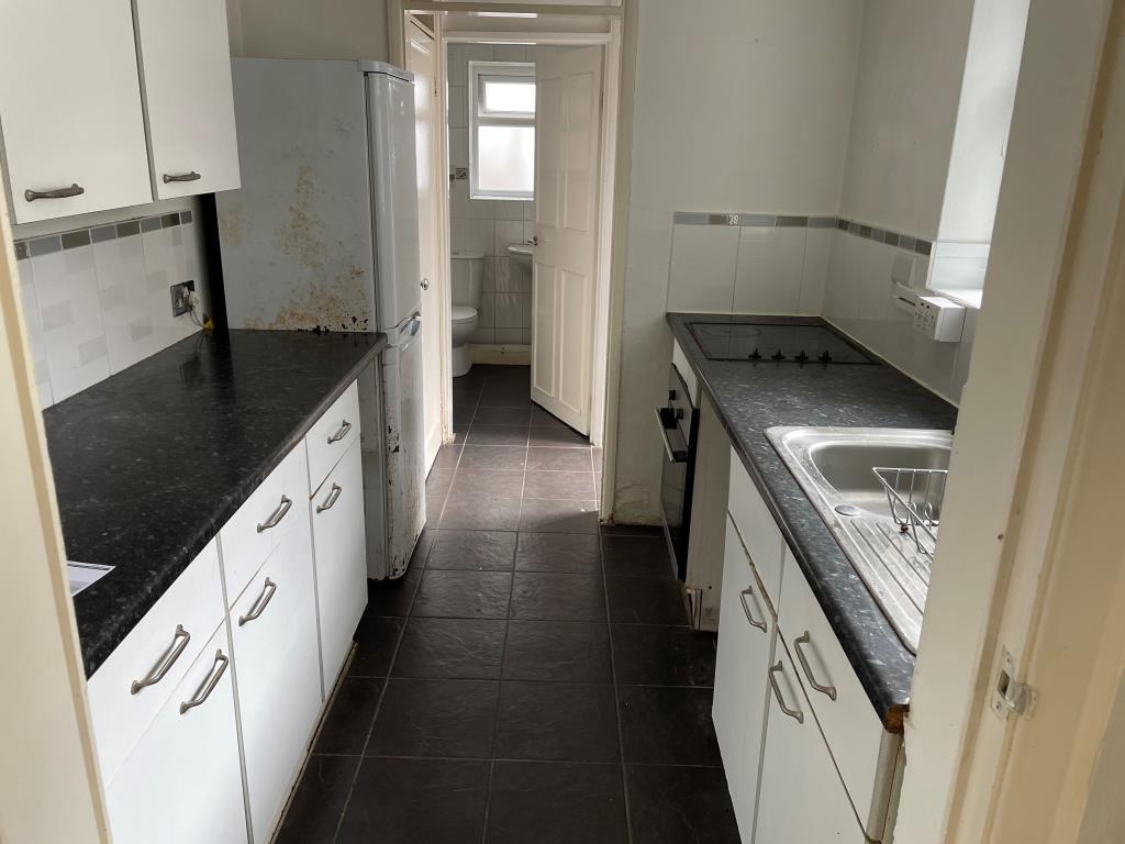 View of fitted kitchen from living room
