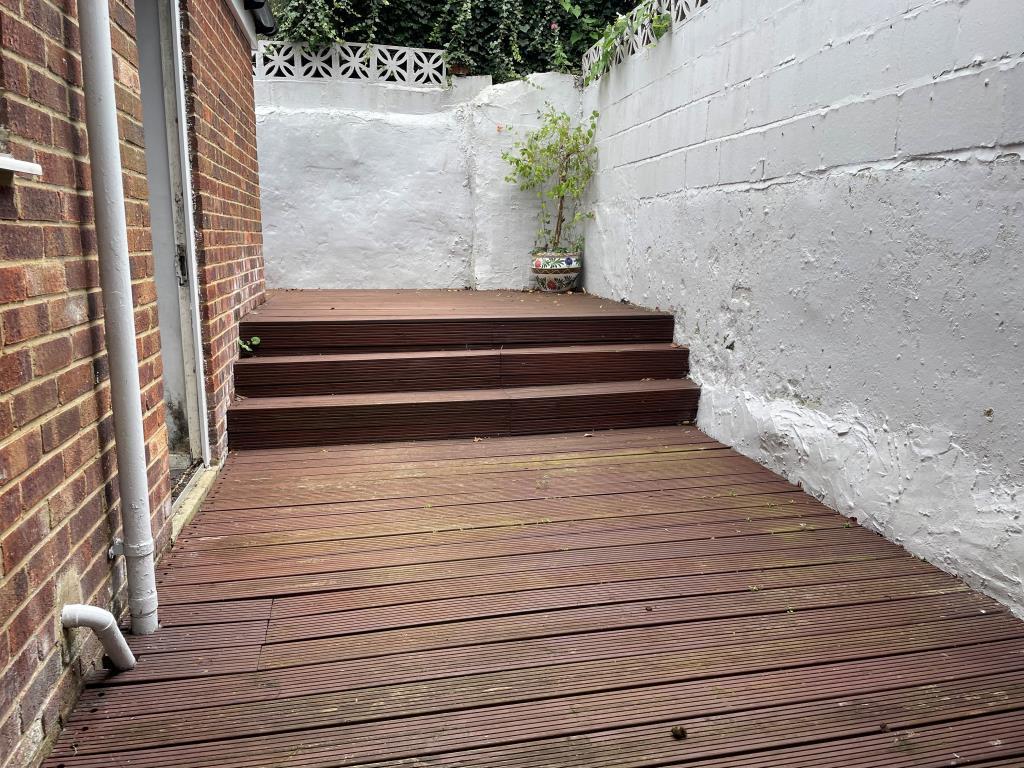 View of decked rear patio from living room