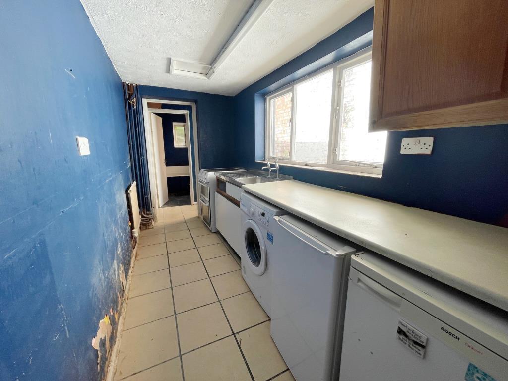 Galley style kitchen with side window