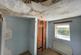Bedroom 2 with boiler cupboard and damaged ceiling