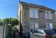 Semi-detached building with drive