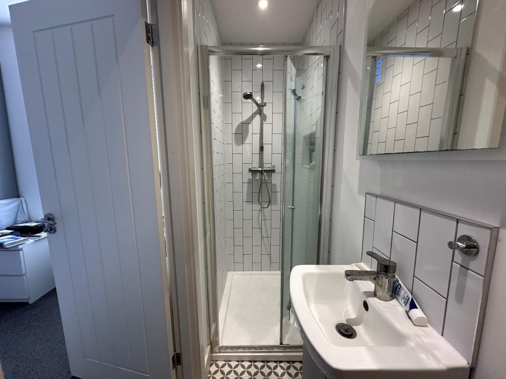 Room four shower room with W.C.