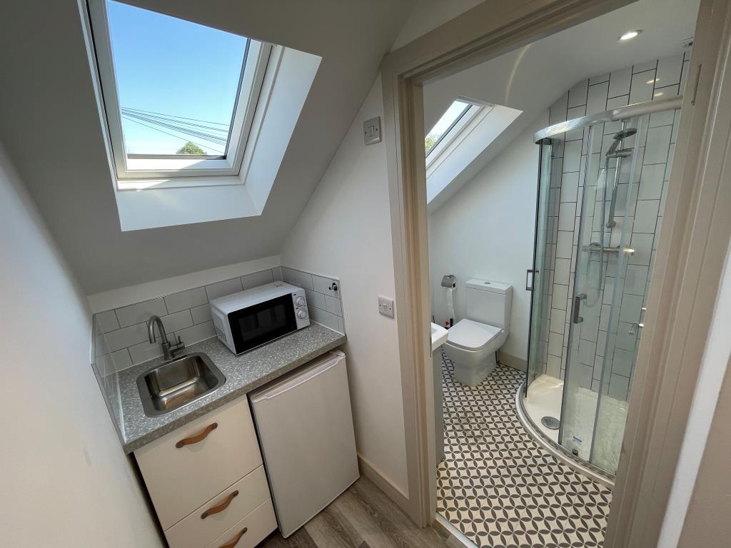 Room Six - kitchenette and shower room