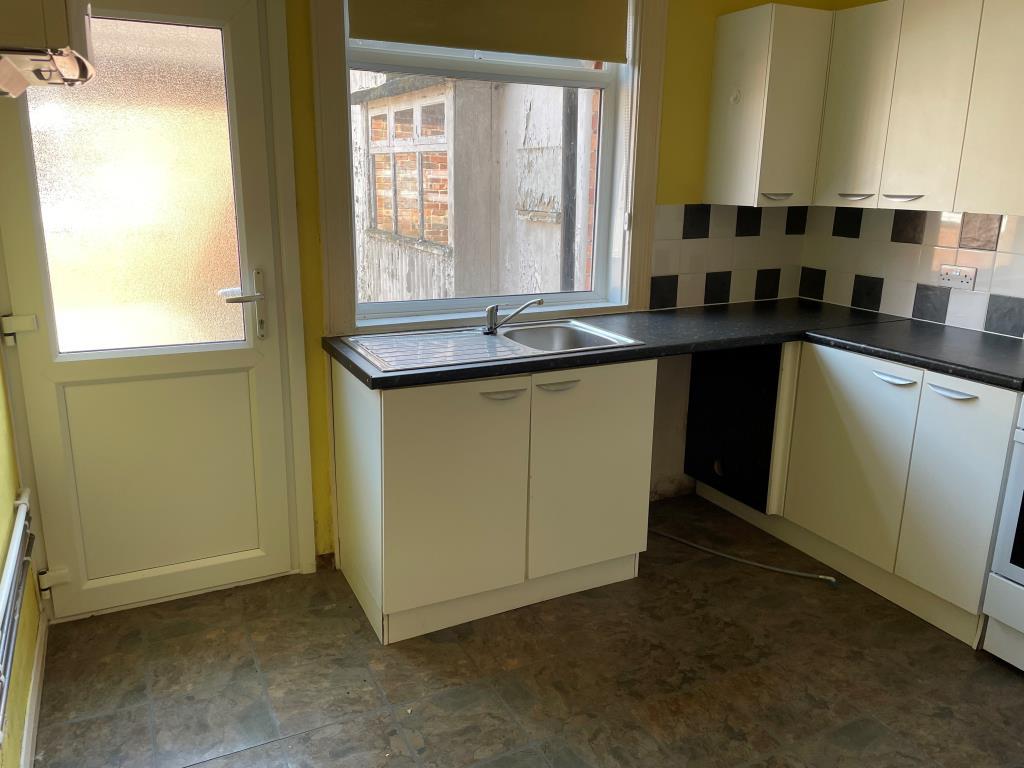 Kitchen on ground floor with access to courtyard