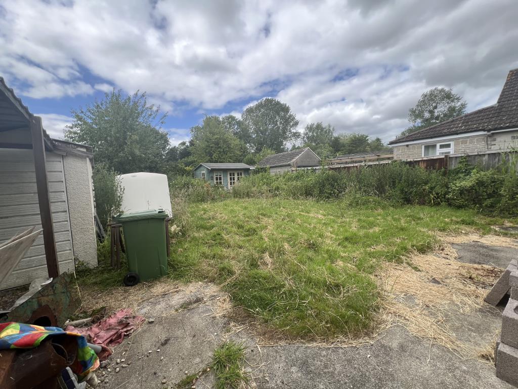 Rear garden showing summer house