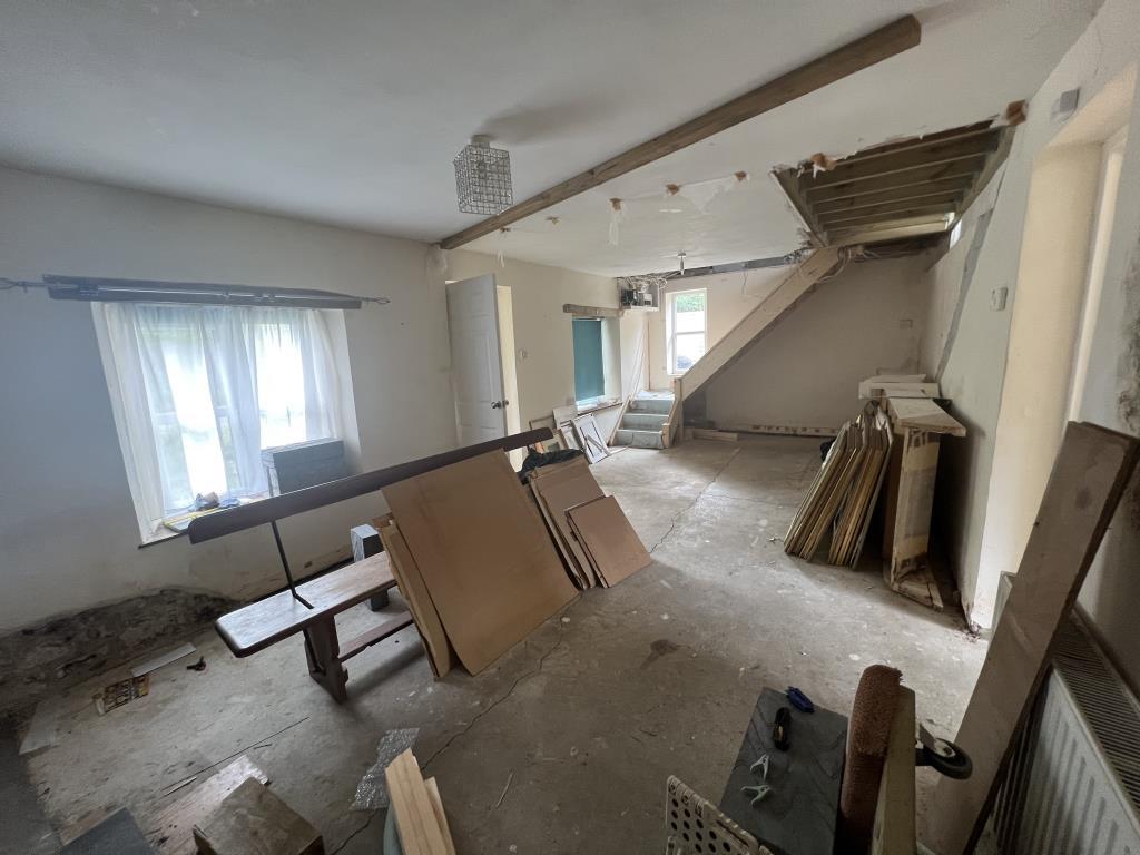 Living and dining room showing door to the porch