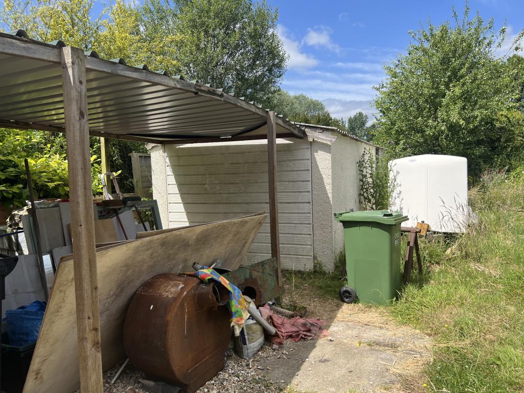 Detached garage with carport