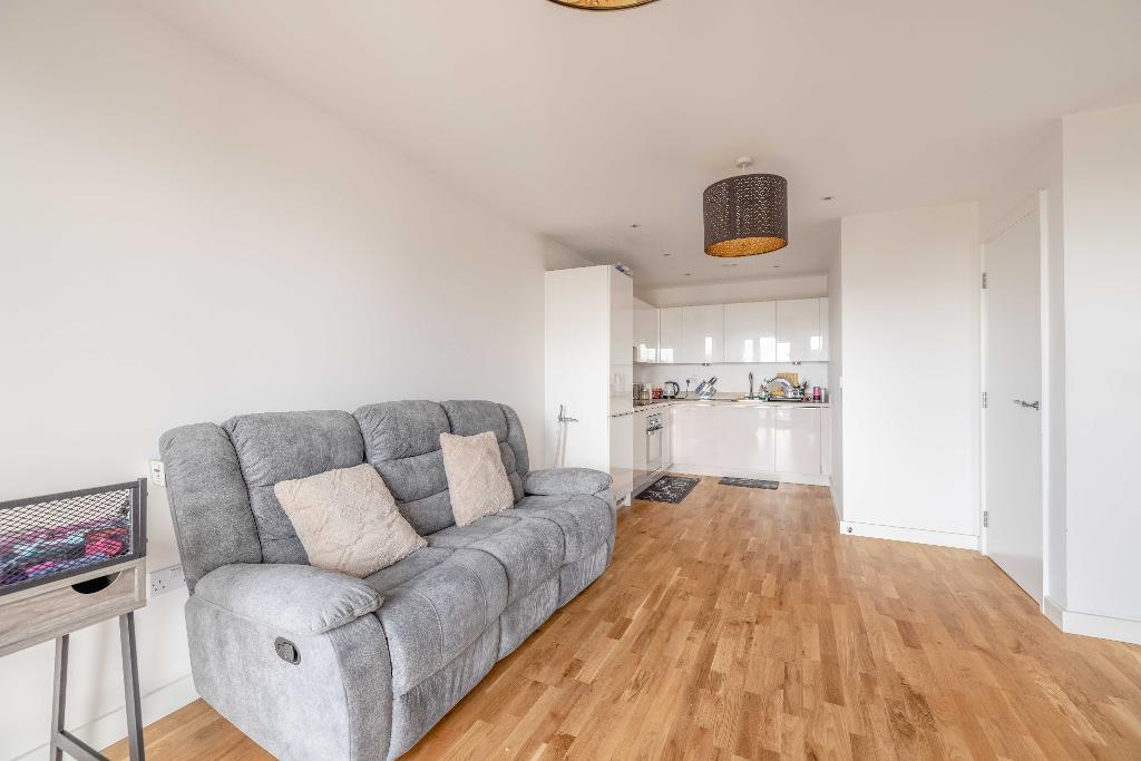 Living room opening to Kitchen