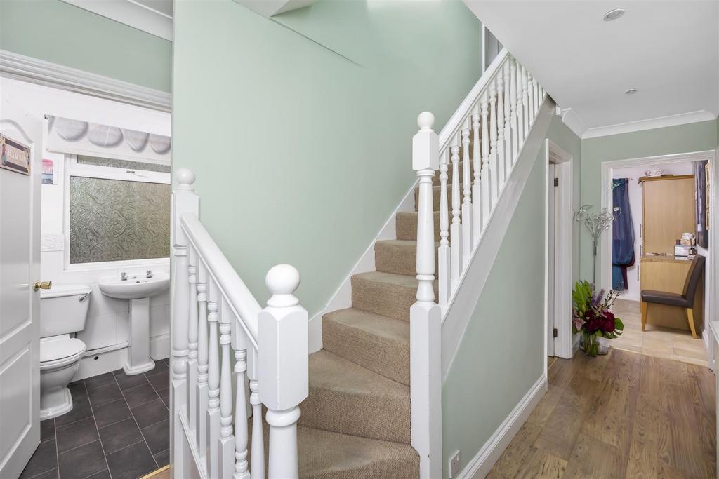Stairs rising to First Floor