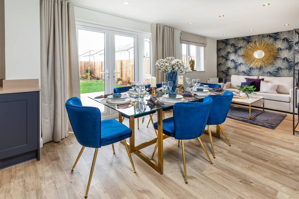 Dining area with patio doors leading to garden...