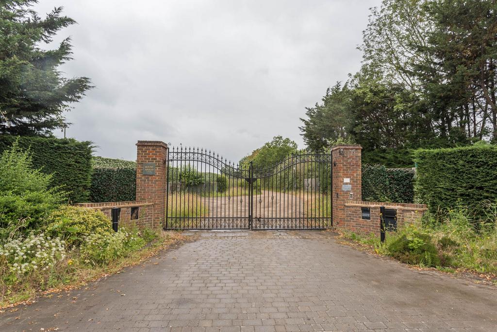 Gated entrance to driveway to property