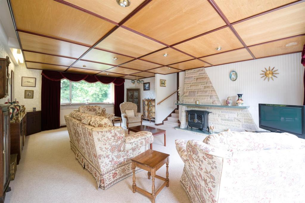 Sitting Room to fireplace and front window.jpg