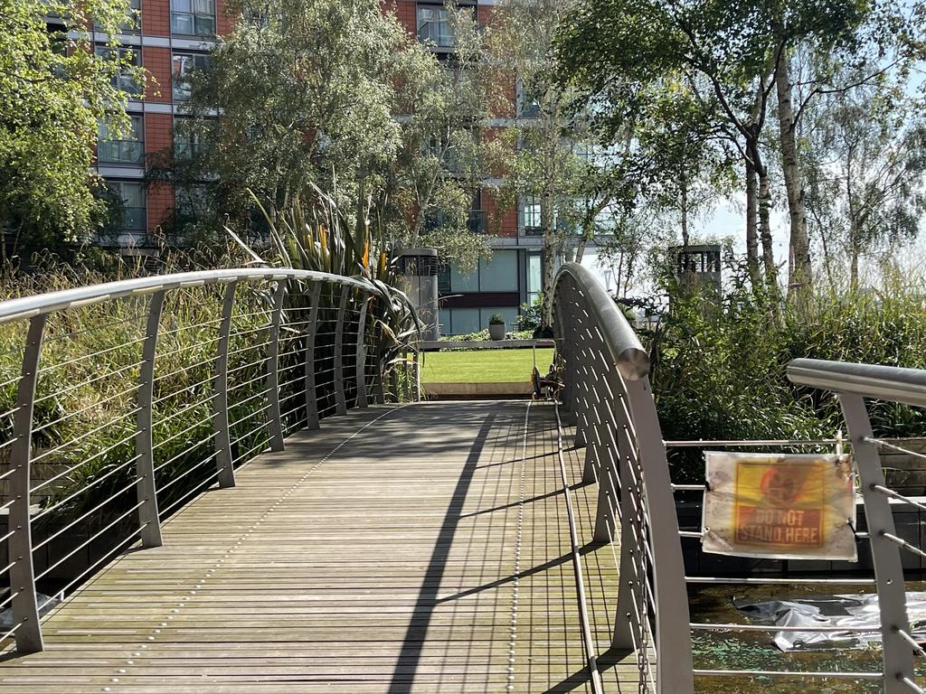 BRIDGE to COMMUNAL LAWNED AREA
