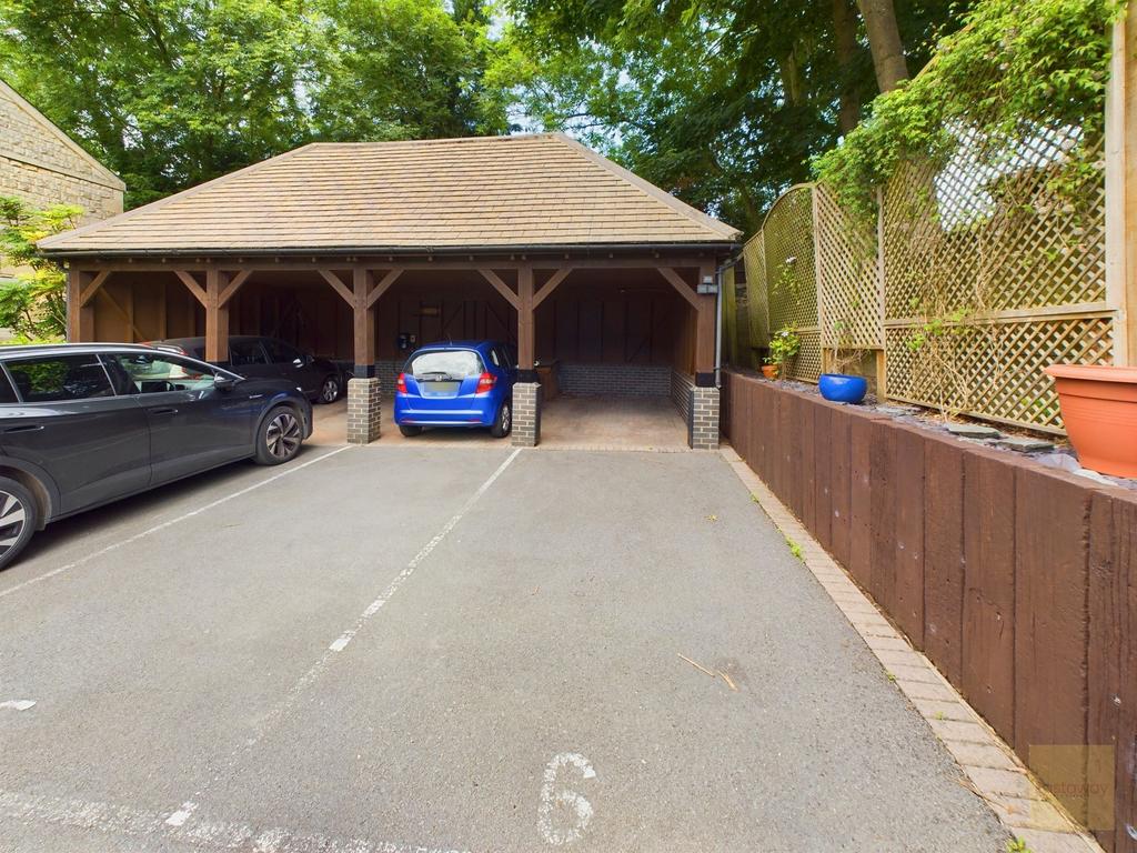 Carport with tandem parking for 2 vehicles.