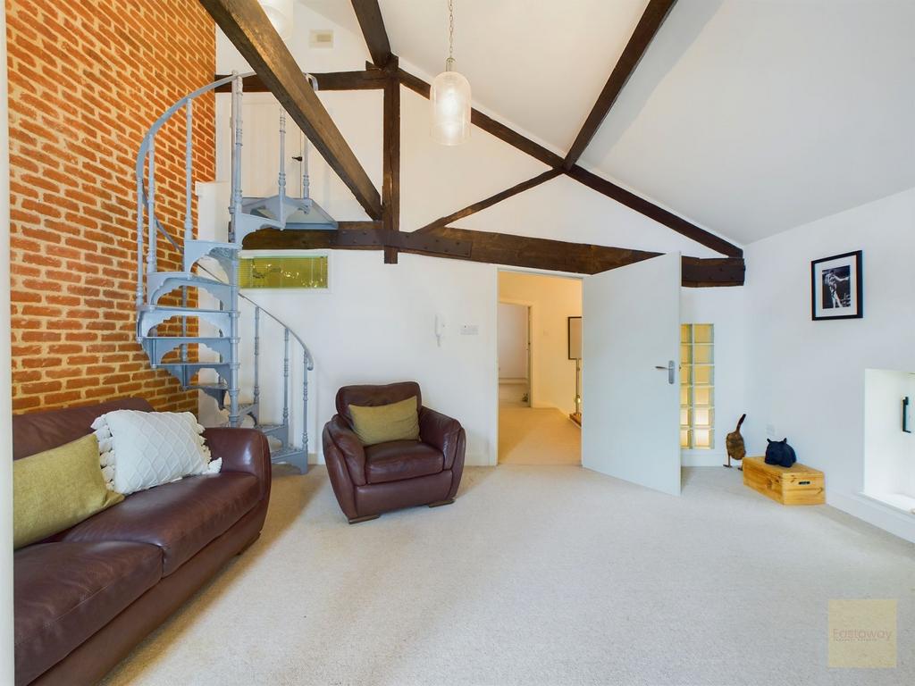 Living room with staircase to fourth floor