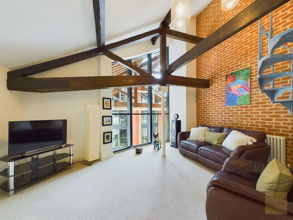 Living room with double height ceiling.