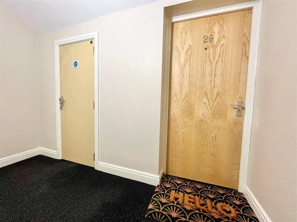 Front door and storage cupboard