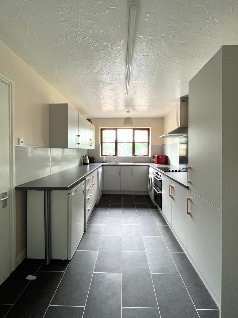 Kitchen with double oven and microwave