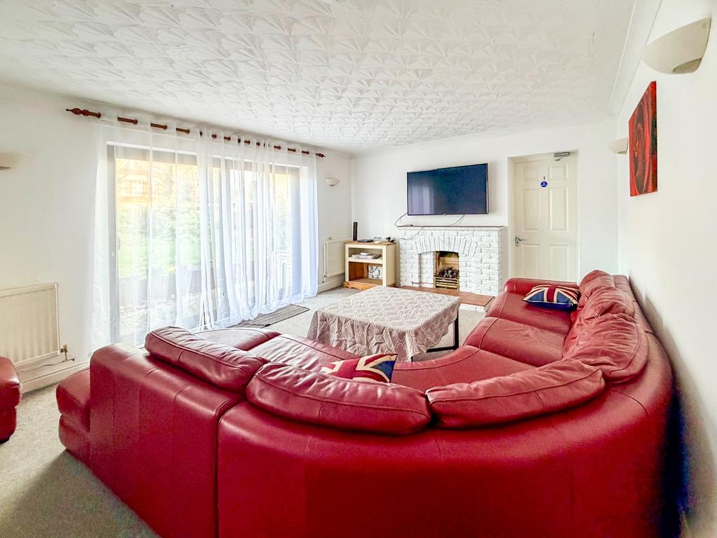Communal lounge with access to garden