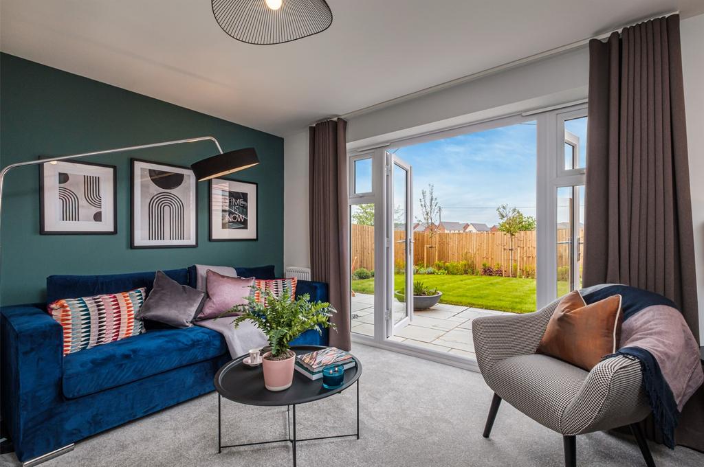 Lounge with blue wall and open french doors