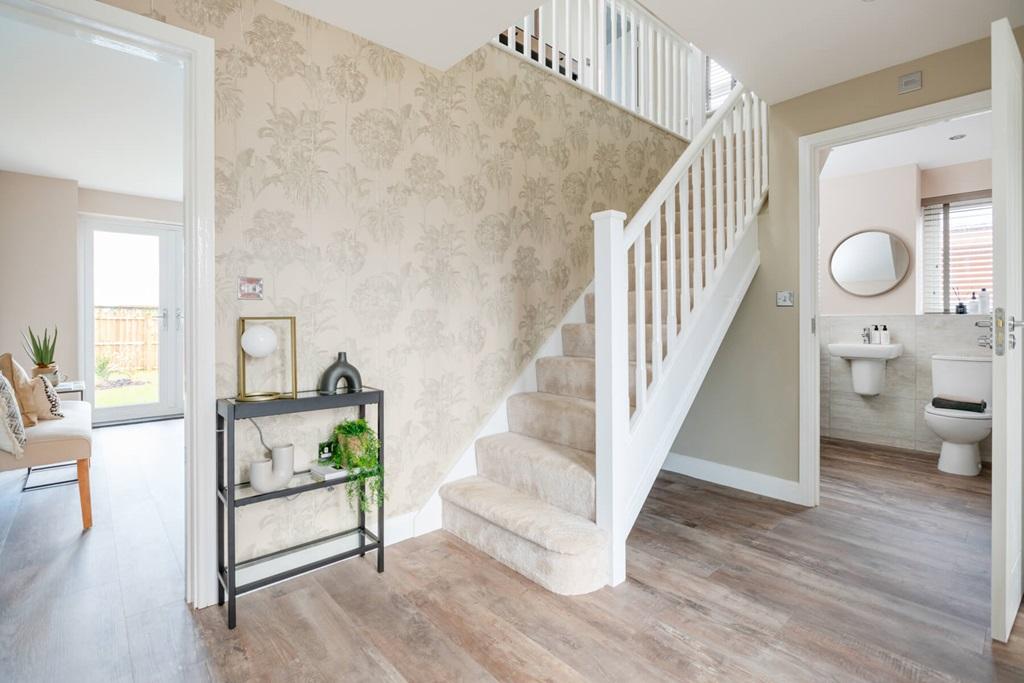 A welcoming hallway that boasts with natural light