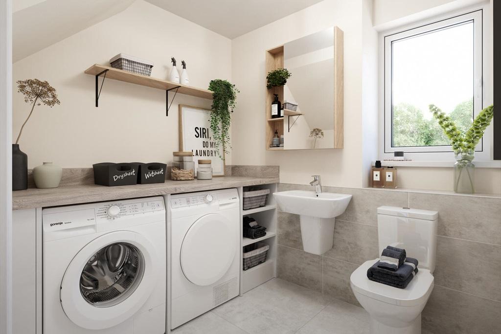 A combined cloakroom and utility adds convenience