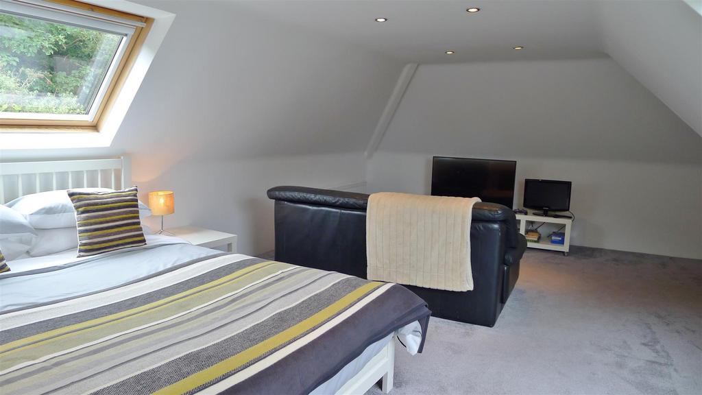 Bedroom 4 and seating area