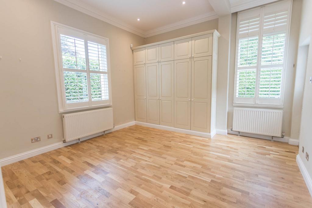 Bedroom 2 with wardrobes