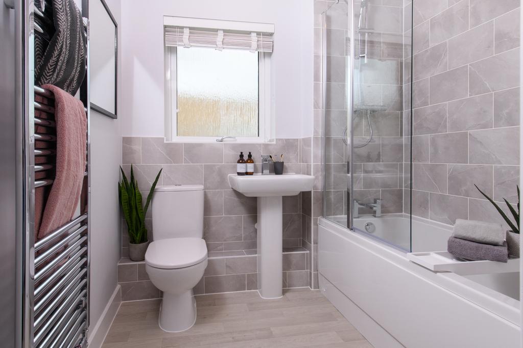 Modern bathroom with over the bath shower