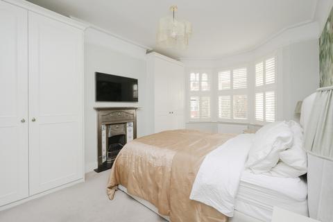 10 Boscombe Road, London, SW19 3AX