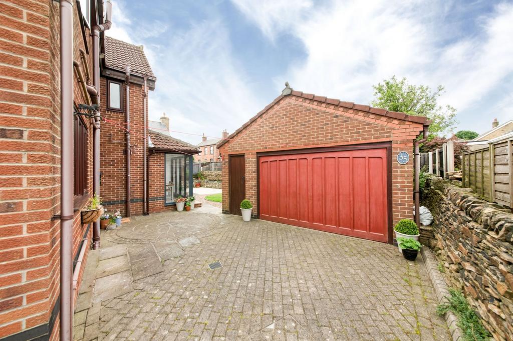 Double garage and driveway