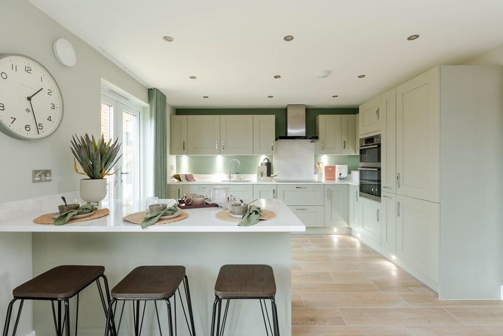 A modern kitchen with breakfast bar