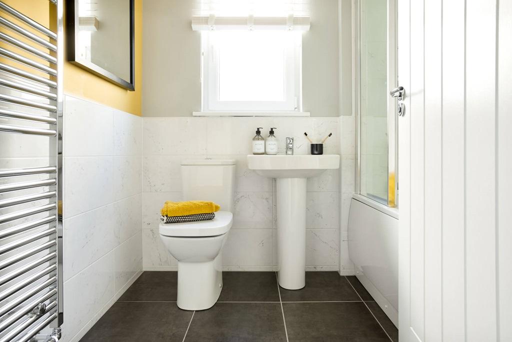 Main bathroom with shower over bath